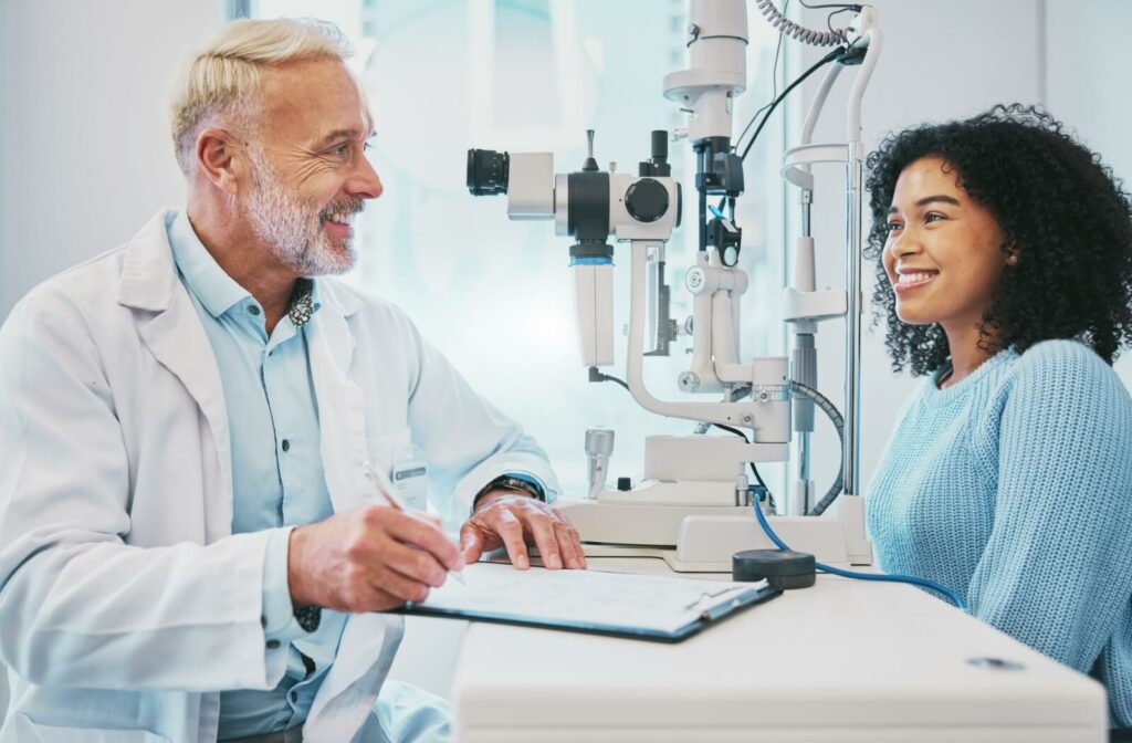 A patient with diabetes going over their health history with their optometrist before an eye exam